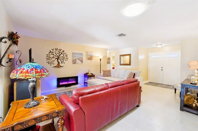 living room with visible vents and baseboards