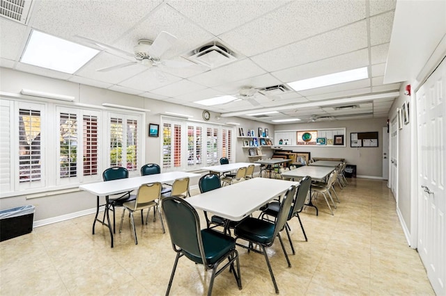 dining room with visible vents, baseboards, a paneled ceiling, and ceiling fan