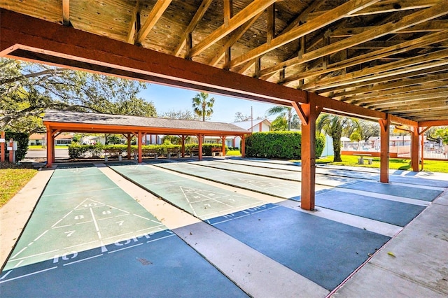 view of home's community featuring shuffleboard