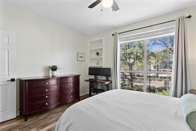 bedroom with a ceiling fan and wood finished floors