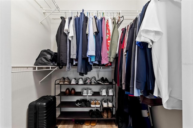 spacious closet with wood finished floors