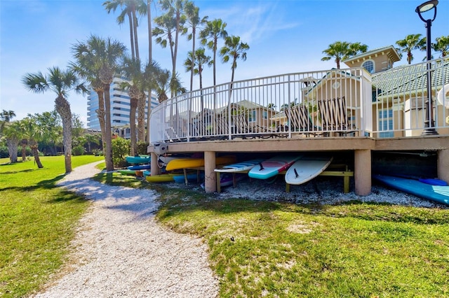 view of property's community with a yard and a wooden deck