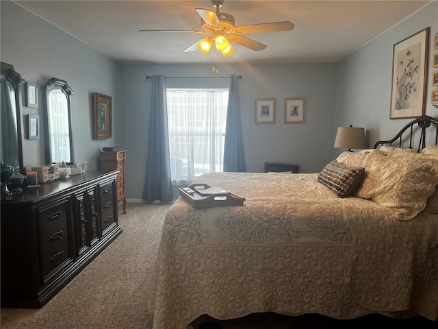 bedroom featuring light carpet and ceiling fan