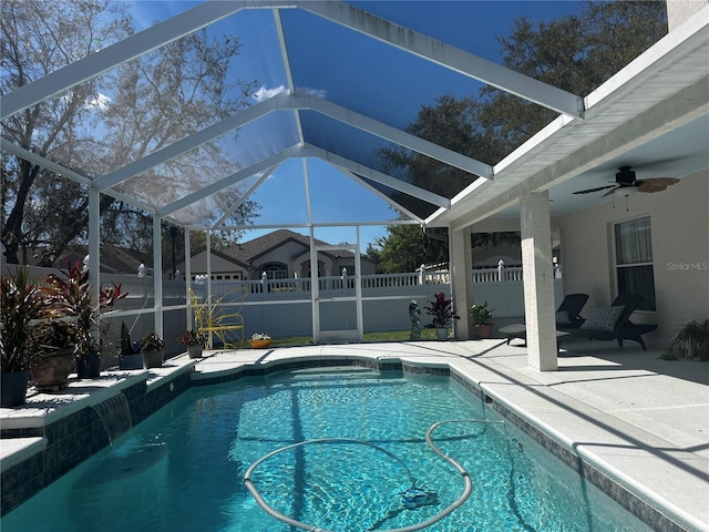 view of pool featuring a ceiling fan, a patio, fence, a fenced in pool, and a lanai