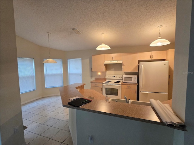 kitchen featuring visible vents, under cabinet range hood, light tile patterned floors, white appliances, and a textured ceiling