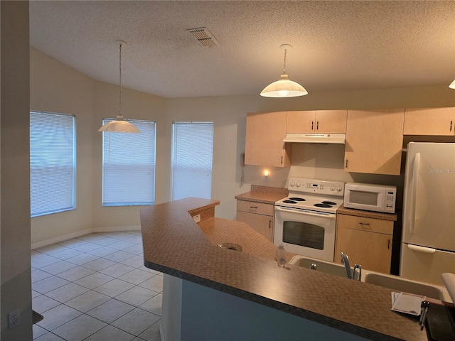 kitchen featuring visible vents, under cabinet range hood, dark countertops, a textured ceiling, and white appliances