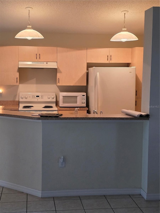 kitchen featuring white appliances, light tile patterned floors, under cabinet range hood, a textured ceiling, and decorative light fixtures