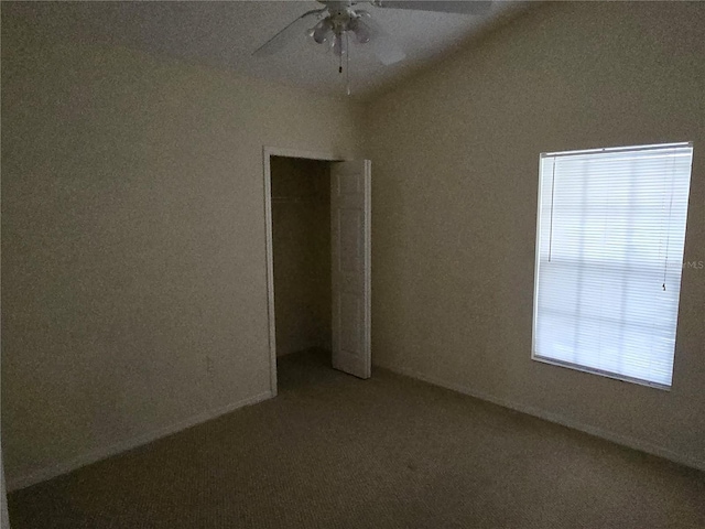 unfurnished room with a ceiling fan and lofted ceiling