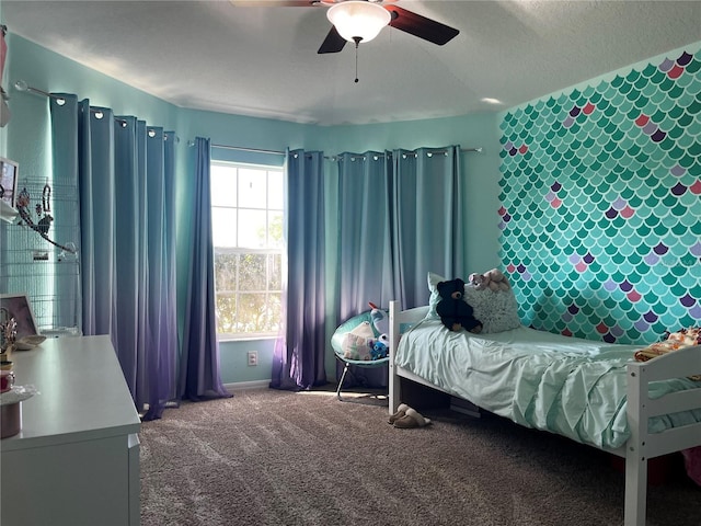 bedroom with carpet flooring, baseboards, and ceiling fan