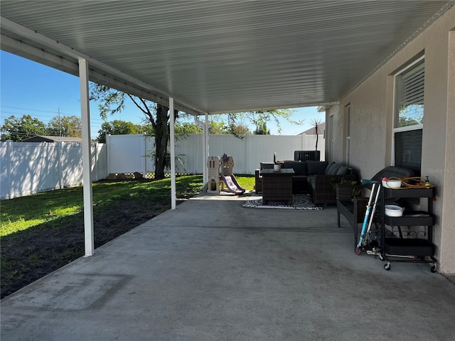 view of patio / terrace with an outdoor living space and a fenced backyard