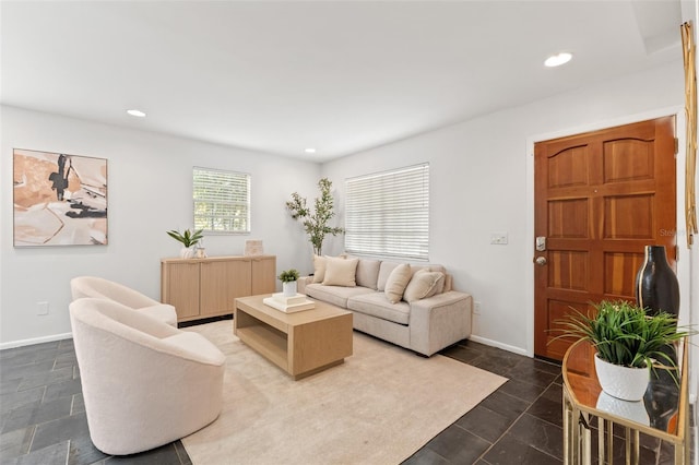 living room with recessed lighting and baseboards