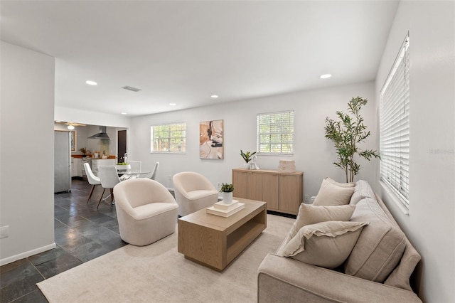 living room featuring recessed lighting and baseboards