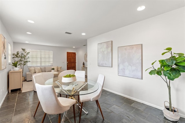 dining area with stone tile flooring, visible vents, recessed lighting, and baseboards