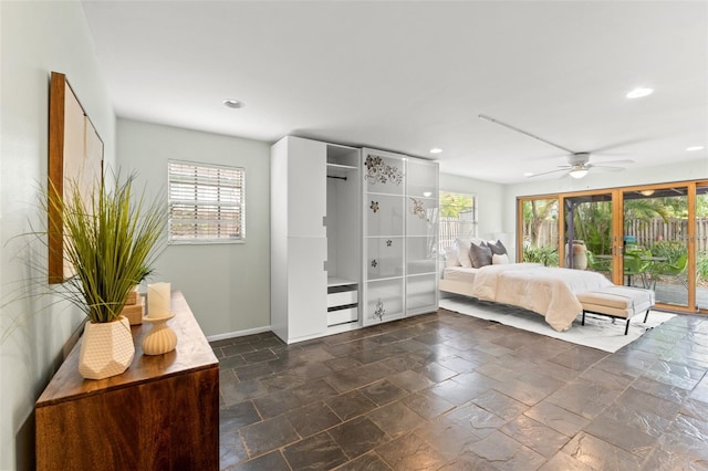 bedroom with recessed lighting, multiple windows, and access to outside