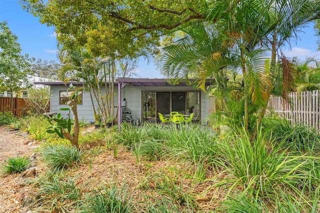 view of front of house with fence