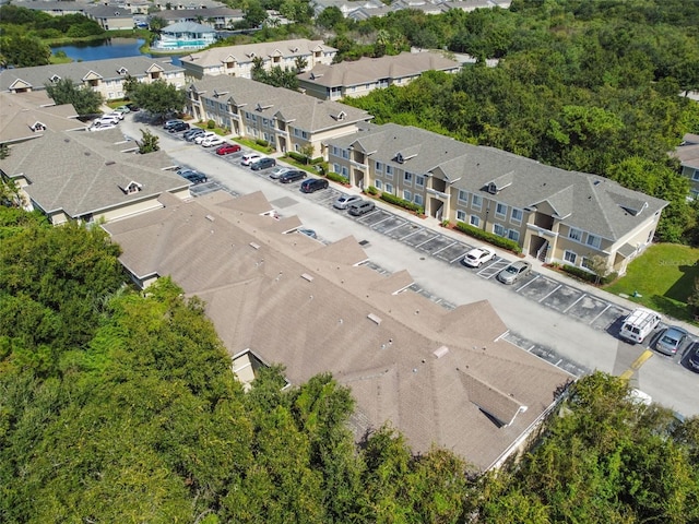 aerial view featuring a residential view and a water view