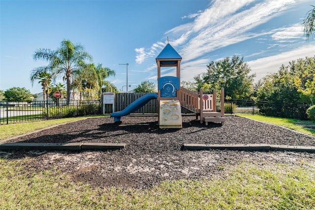 community jungle gym featuring fence