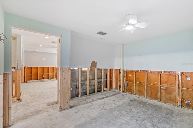 unfurnished room with visible vents and a ceiling fan