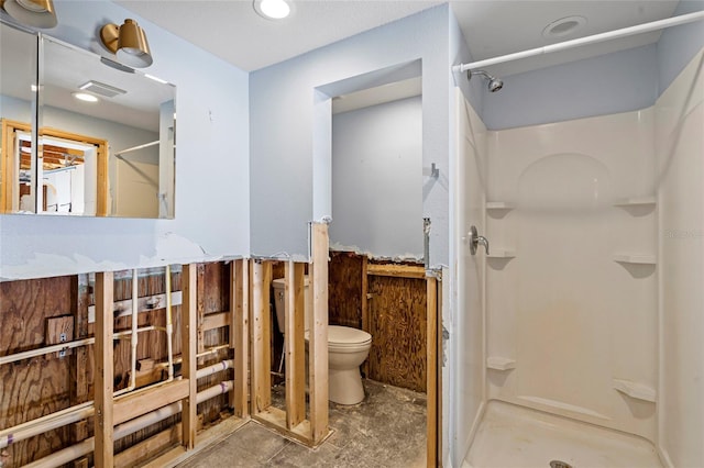 bathroom with visible vents, toilet, and a shower stall