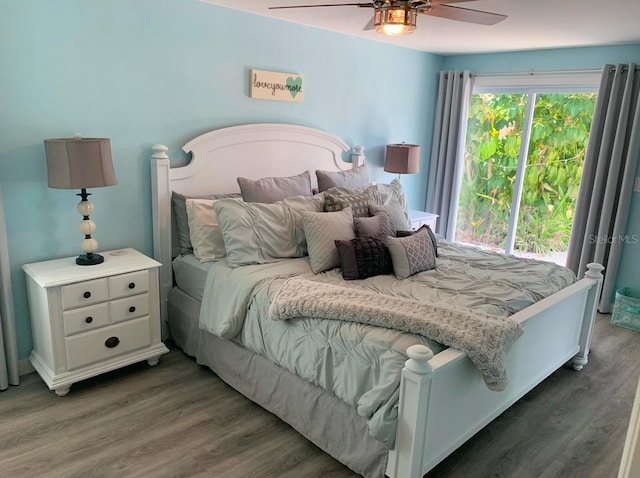 bedroom with a ceiling fan and wood finished floors