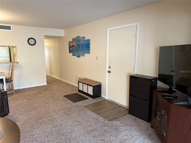 interior space featuring baseboards and visible vents