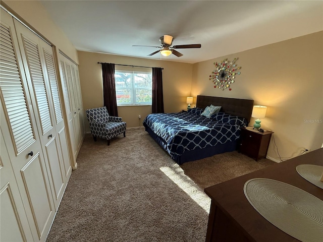 bedroom featuring carpet flooring, multiple closets, and ceiling fan