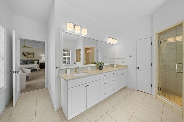 full bathroom with tile patterned flooring, a shower stall, ensuite bathroom, and a sink