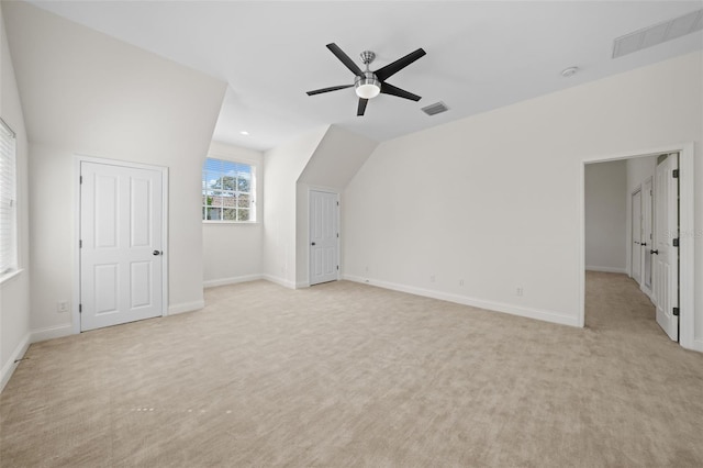 bonus room featuring light carpet, visible vents, and baseboards