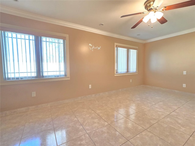 unfurnished room with ceiling fan, light tile patterned floors, baseboards, and ornamental molding