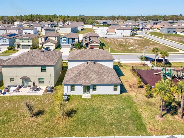 birds eye view of property with a residential view