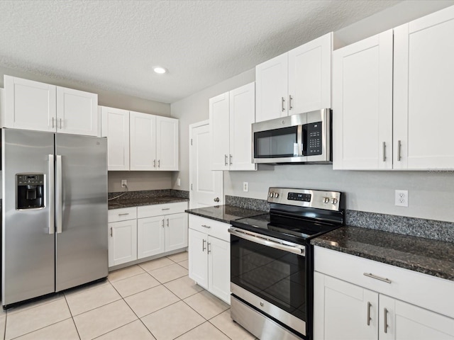 kitchen featuring appliances with stainless steel finishes and white cabinets