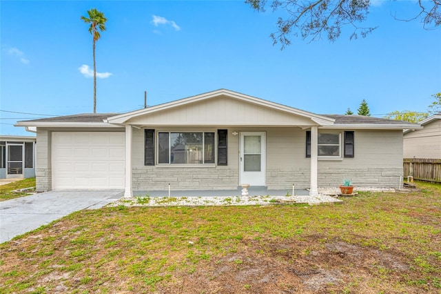 ranch-style home with a front lawn, fence, a garage, stone siding, and driveway