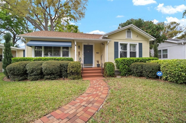 ranch-style home with a front yard