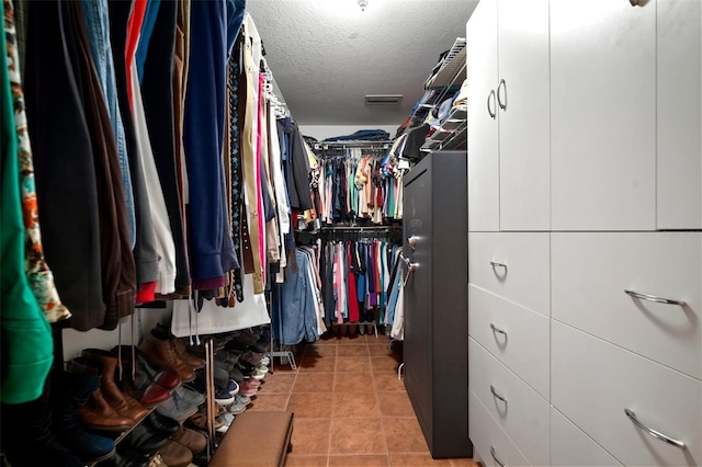 walk in closet with tile patterned floors and visible vents