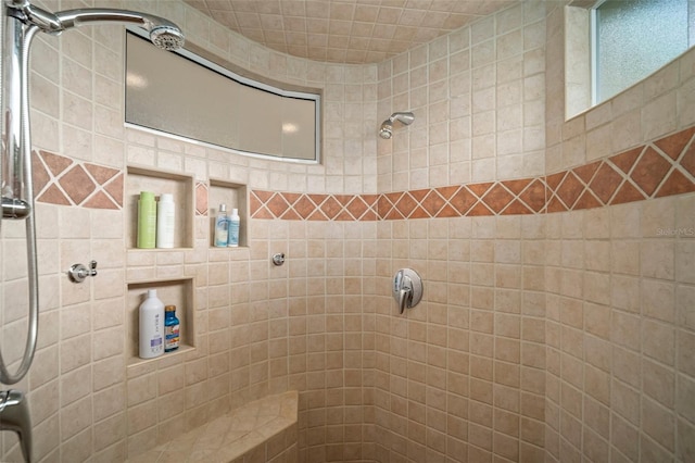 full bathroom featuring a tile shower