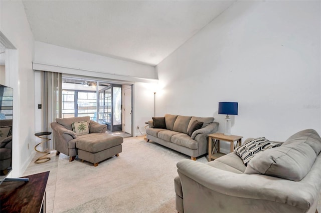 living room featuring lofted ceiling