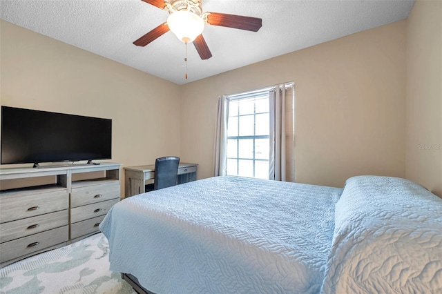 bedroom featuring a textured ceiling and ceiling fan