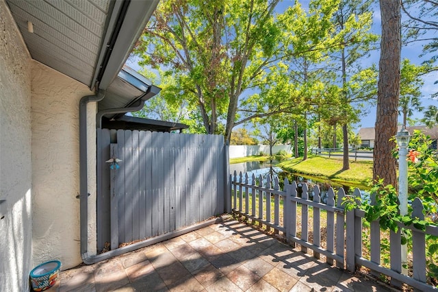 view of patio featuring fence