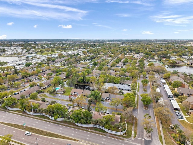 bird's eye view with a residential view and a water view