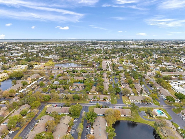 birds eye view of property with a water view and a residential view