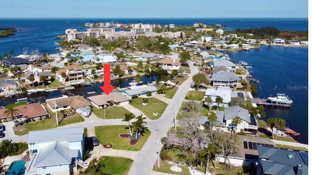 aerial view with a residential view and a water view