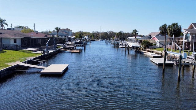 view of dock featuring a residential view and a water view