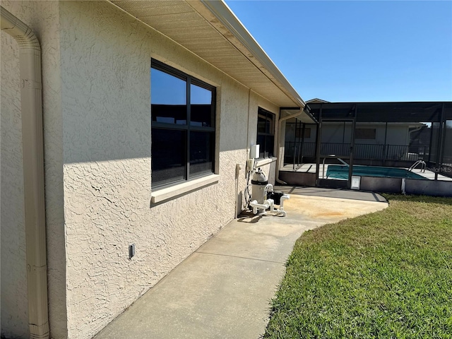 view of patio with a lanai and a fenced in pool