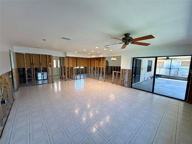 unfurnished room featuring plenty of natural light, recessed lighting, a ceiling fan, and visible vents