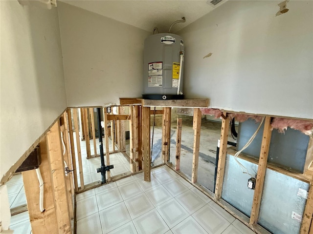 utility room featuring electric water heater