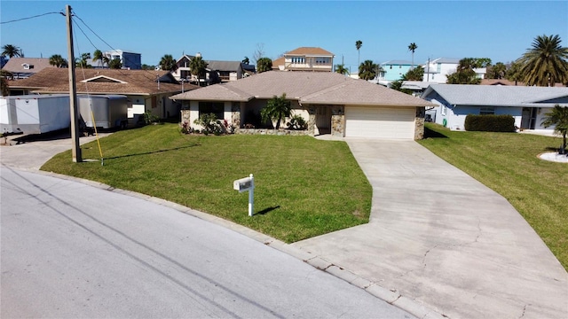 ranch-style home with an attached garage, a front lawn, a residential view, stone siding, and driveway