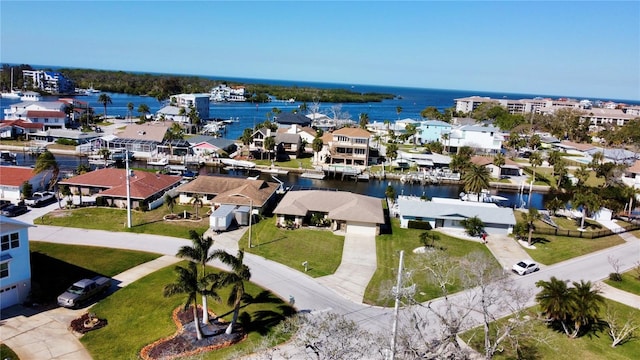 birds eye view of property with a residential view and a water view