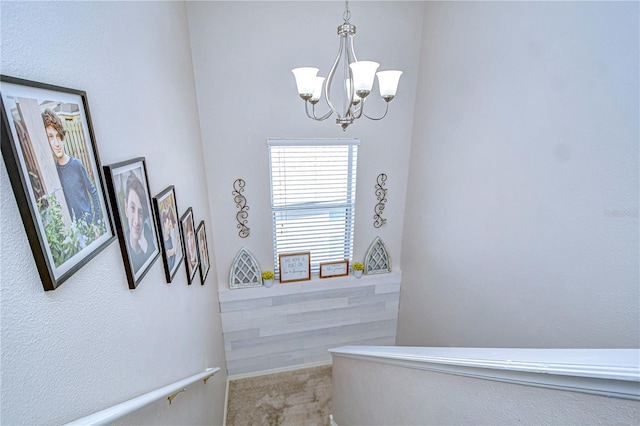 bathroom with a chandelier