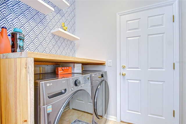 laundry area featuring light tile patterned floors, independent washer and dryer, and laundry area