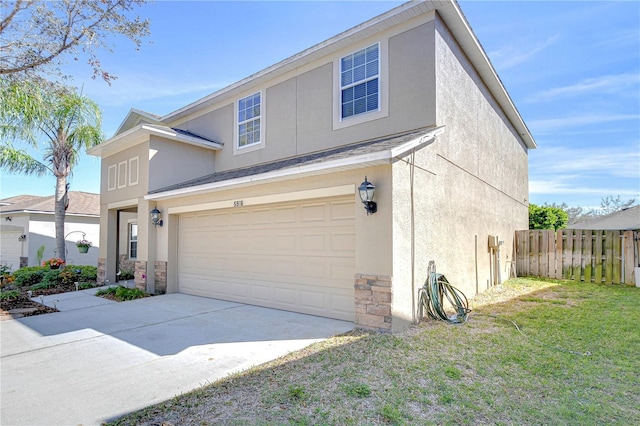 view of front of house with fence, stucco siding, concrete driveway, a garage, and stone siding